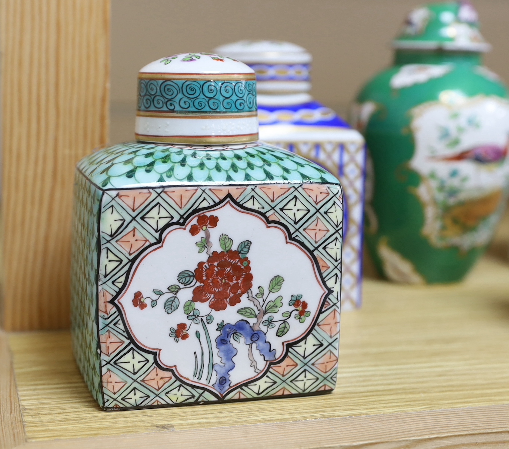 A collection of Paris porcelain tea canisters, imitating Sevres, Chinese export etc. tallest jar and cover 15cm high